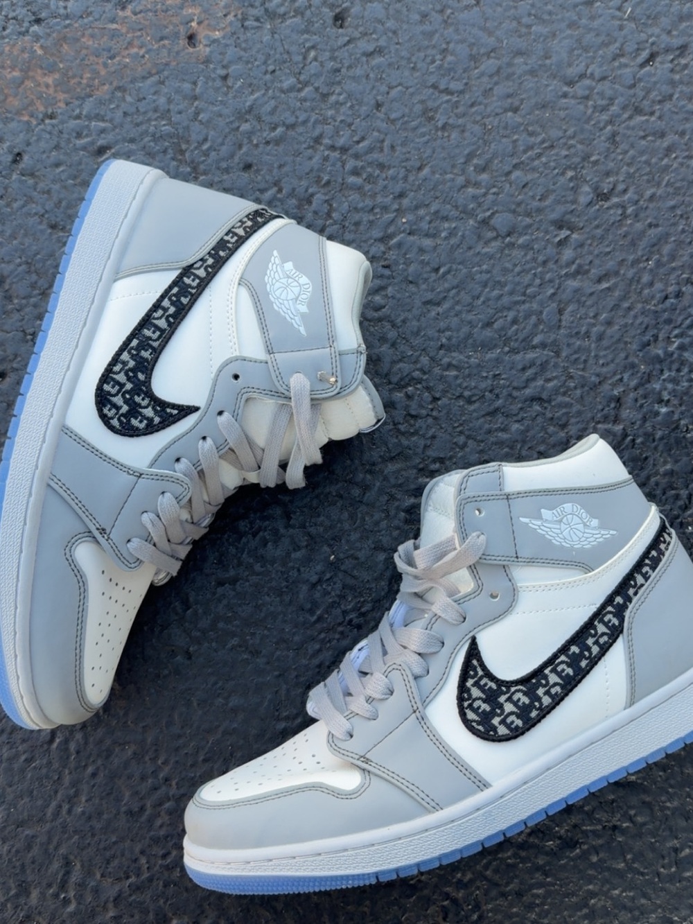 Nike High-Top Sneakers in White and Light Gray with Patterned Black Swoosh